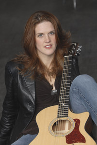  Writer Bonnie Jean Feldkamp poses with her guitar. 