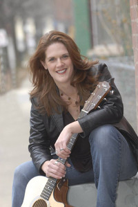  Writer Bonnie Jean Feldkamp poses with her guitar. 