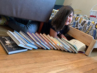  The author's son with some of his books. Photo credit: Bonnie Jean Feldkamp. 
