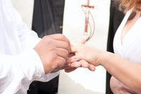  The author and her husband exchange rings during their wedding ceremony. 