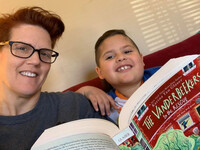  The author reads with her son. 