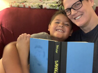  The author reads with her son. 