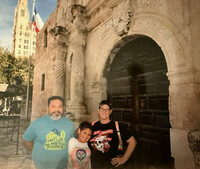 The family stands in front of the Alamo Mission: Felipe Cisneros, Ezra Cisneros and Bonnie Jean Feldkamp. Photo courtesy of Bonnie Jean Feldkamp.