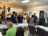 Bishop Dennis Lyons and Deputy Police Chief Steve Healy at the Bishop's Table. Photo courtesy of Bonnie Jean Feldkamp