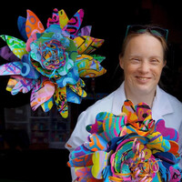  Stacey Strickmaker poses with Passion Flowers made in PassionWorks Studio in Athens, Ohio. Photo: PassionWorks Studio 