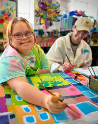  Emily Demko and Tanner Ingle paint an upcycled aluminum print plate in PassionWorks Studio in Athens, Ohio. Photo: PassionWorks Studio 