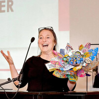  Patty Mitchell shows off a Passion Flower made in PassionWorks Studio in Athens, Ohio. Photo: PassionWorks Studio 