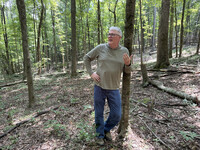 Allen Pursell stands in Stoler Creek Forest 18 months after it burned. Photo credit: Bonnie Jean Feldkamp. 
