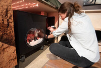 American Prairie Operations Coordinator Emma Hale assembles the black-footed ferret enclosure for American Prairie's newest ambassador. Photo Credit: Anna Schale. 