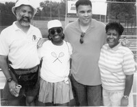  Muhammad Ali poses with members of the West Louisville Tennis Club at Chickasaw Park. Photo Credit: Olmsted Parks Conservancy. 