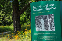  Muhammad Ali is pictured on the meadow's new sign. Photo Credit: Olmsted Parks Conservancy 