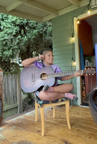 Ezra Cisneros plays guitar. Photo Credit: Bonnie Jean Feldkamp