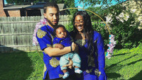  Armelle and Terrance Bradshaw hold their infant son. Photo credit: Terrance Bradshaw. 