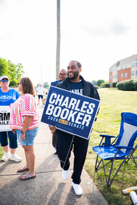 Charles Booker hands out yard signs on the campaign trail in Kentucky. Photo Credit: Charles Booker.