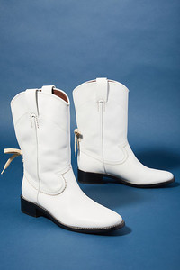 White boots are a surprising fall fashion trend, and western boots step out in front. See these boots by Chloe Annika at Anthropologie. www.anthropologie.com.