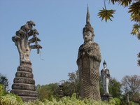 One of the most dramatic pieces seen at the Buddhist Sculpture Park during a Mekong Explorer cruise is that of a monk meditating under a 60-foot-high Naga snake. Photo courtesy of Sandra Scott.