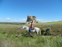 A cowboy poses before Jail rock formation near the Oregon Trail in the Nebraska Panhandle. Photo courtesy of Steve Bergsman.