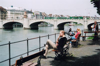 Residents of Basel, Switzerland, take a lunch break along the relaxing Rhine River. Photo courtesy of Sharon Whitley Larsen.