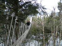  A guide instructs a beginner on using the zipline in Bretton Woods, New Hampshire. Photo courtesy of Steve Bergsman. 