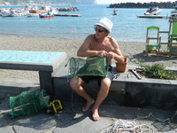 A man constructs fishing nets in Sant' Angelo, Ischia, off the coast of Italy. Photo courtesy of Steve Bergsman.