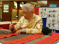 A calligrapher prepares for Chinese New Year in Richmond, British Columbia. Photo courtesy of Steve Bergsman. 