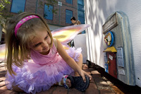A child finds one of the mysterious fairy doors in Ann Arbor, Mich. Photo courtesy of www.visitannarbor.org.