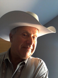The author suits up with the locals during July's Calgary Stampede in Calgary, Alberta, Canada. Photo courtesy of Jim Farber.