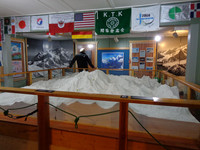 A to-scale model of Mount McKinley is surrounded by historical information about the mountain and flags of international hikers who have scaled its summit. Photo courtesy of Lesley Sauls.