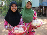  Young women sell treats in Chan Village, Vietnam. Photo courtesy of Sandra Scott. 