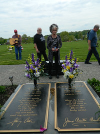 Joanne Cash Yates visits the gravesite of her brother, Johnny Cash, and her sister-in-law, June Carter Cash, in Hendersonville, Tennessee. Photo courtesy of Steve Bergsman.