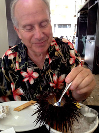 The author dines on a sea urchin, a specialty at the Hungry Cat in Santa Barbara, California. Photo courtesy of Jim Farber.