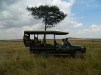  Vehicles such as this one carry safari-goers through the Maasai Mara in Kenya. Photo courtesy of Steve Bergsman. 