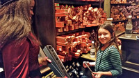  A young student witch at Hogwarts chooses her first wand at "The Wizarding World of Harry Potter" attraction at Universal Studios in Los Angeles. Photo courtesy of Jim Farber. 