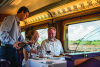  A couple enjoys a gourmet meal with local wines in the Queen Adelaide Restaurant Car on the Indian Pacific excursion train in Australia. Photo courtesy of Great Southern Railroad.. 