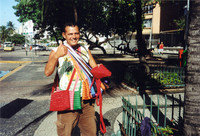 A friendly street vendor sells colorful purses in the Copacabana area of Rio de Janeiro, Brazil.</p>
<p>Photo courtesy of Sharon Whitley Larsen.