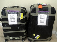  First Luggage shrink-wraps suitcases so that they experience less wear and tear during shipment. Photo courtesy of Sheila Sobell. 