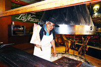  An Argentine chef barbecues beef, pork, lamb and chicken at the famous Las Nazarenas steak house in Buenos Aires, Argentina. Photo courtesy of Patricia Arrigoni. 