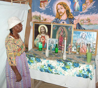 Erdengela Polonio, a healer in Belize, prepares for a ceremony to help people who can't walk. Photo courtesy of Victor Block.