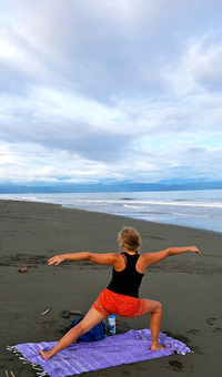 . A visitor to Puerto Jimenez, Costa Rica, does yoga on the beach. Photo courtesy of Jim Farber. 