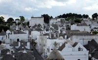 Trulli architecture in Alberobello, Italy, delights passengers who have arrived on the train from Bari. Photo courtesy of Richard N. Every.