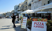 Restaurants in Trani, Italy, tempt visitors who have arrived by train. Photo courtesy of Richard N. Every.