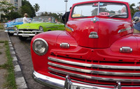 Colorful automobiles from another era serve as taxis in Havana, Cuba. Photo courtesy of Phillip Courter.