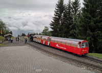 The vintage Brienz Rothorn Steam Train makes a mid-mountain stop at 4,399 feet above sea level on Brienzer Mountain above the village of Brienz in central Switzerland. Photo courtesy of Athena Lucero.
