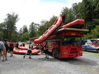  Members of the staff at Smoky Mountains Outdoors load rafts onto the bus that will take them to the Pigeon River. Photo courtesy of Bill Neely. 