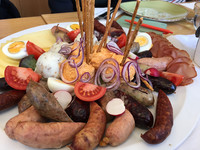 The vintner's platter in Volkach, Germany, comes with sausages, cheese, eggs and more. Photo courtesy of Candyce H. Stapen.