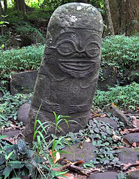 The head of the smiling Tiki found on Hiva Oa in the Marquesas symbolizes power and his eyes knowledge. Photo courtesy of Philip Courter.
