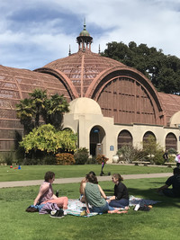 Visitors picnic in the sunshine between Balboa Park's famed Botanical Building and</p>
<p>the Timken Museum of Art in San Diego. Photo courtesy of Lesley Sauls.