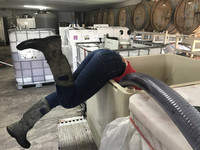  An employee at Plum Hill Vineyards in Gaston, Oregon, cleans a tank. Photo courtesy of Plum Hill Vineyards. 