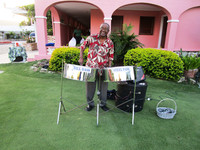  Musician Bill Bass plays outside The Terrace restaurant for guests at St. Croix's Buccaneer resort. Photo courtesy of Steve Simonsen. 