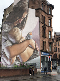 Murals on the sides of buildings in Glasgow, Scotland, are one way the city celebrates the arts. Photo courtesy of Candyce Stapen.